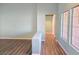 Hallway featuring wood-look floors, neutral walls, and natural light at 3117 Brightridge Dr, Las Vegas, NV 89134
