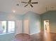Bright living room showcasing vaulted ceilings, a ceiling fan, and natural light from a window at 3117 Brightridge Dr, Las Vegas, NV 89134