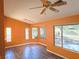 Cozy living room features stylish ceiling fan and light-filled bay windows at 3117 Brightridge Dr, Las Vegas, NV 89134