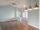 Open living area featuring wood floors, an airy design, and modern light fixtures at 3117 Brightridge Dr, Las Vegas, NV 89134