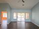 Open living space with wood-look floors and sliding glass doors leading to the backyard at 3117 Brightridge Dr, Las Vegas, NV 89134