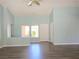 Bright living area with wood-look floors, neutral walls, and a front door view at 3117 Brightridge Dr, Las Vegas, NV 89134