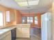 Kitchen area featuring granite countertops, a breakfast bar, and wood floors at 3117 Brightridge Dr, Las Vegas, NV 89134