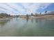 Picturesque pond with fountains, mature trees, and a view of the neighborhood in the background at 3117 Brightridge Dr, Las Vegas, NV 89134