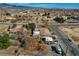 The aerial shot captures the house, landscaping, and neighborhood from an elevated perspective at 3140 Unicorn Ave, Pahrump, NV 89048