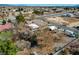 Wide aerial view of the property showcasing the home, trees, and surrounding neighborhood at 3140 Unicorn Ave, Pahrump, NV 89048