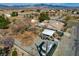 The elevated shot shows the house with mountain views, back yard, and community proximity at 3140 Unicorn Ave, Pahrump, NV 89048