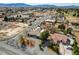 Expansive aerial view showcasing the home, mature trees and the quiet neighborhood at 3140 Unicorn Ave, Pahrump, NV 89048