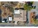 Aerial real estate image showcasing the house roof and landscaping from a high point of view at 3140 Unicorn Ave, Pahrump, NV 89048