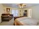 Spacious bedroom with carpeted floors, ceiling fan, and natural light at 3140 Unicorn Ave, Pahrump, NV 89048