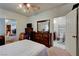 Bedroom with a view into the bathroom and living room with a large dresser at 3140 Unicorn Ave, Pahrump, NV 89048
