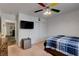 Bedroom featuring a ceiling fan, closet and TV at 3140 Unicorn Ave, Pahrump, NV 89048