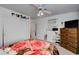 Bright bedroom features a light ceiling fan, closet, and carpeted floors at 3140 Unicorn Ave, Pahrump, NV 89048