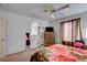 Bedroom features a light ceiling fan, window, and carpeted floors at 3140 Unicorn Ave, Pahrump, NV 89048