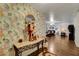 Inviting entryway with decorative wallpaper and elegant furnishings at 3140 Unicorn Ave, Pahrump, NV 89048