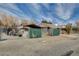 Property with covered parking featuring fencing and mature trees at 3140 Unicorn Ave, Pahrump, NV 89048