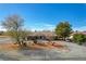 Spacious single-story home with gravel landscaping and mature trees at 3140 Unicorn Ave, Pahrump, NV 89048