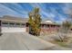 Attached garage with a concrete driveway, part of a charming brick home at 3140 Unicorn Ave, Pahrump, NV 89048