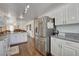 Open kitchen featuring stainless steel refrigerator and bar stool seating at 3140 Unicorn Ave, Pahrump, NV 89048