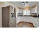 A kitchen with stainless steel refrigerator and white cabinets at 3140 Unicorn Ave, Pahrump, NV 89048