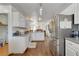 Bright, open kitchen with stainless steel appliances and attached pantry at 3140 Unicorn Ave, Pahrump, NV 89048