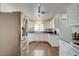 Bright kitchen with stainless steel appliances, hardwood floors, and white cabinets at 3140 Unicorn Ave, Pahrump, NV 89048
