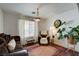 Cozy living room with accent seating, area rug, plants, and natural lighting at 3140 Unicorn Ave, Pahrump, NV 89048