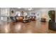 Open-concept living room featuring hardwood floors and comfortable leather furniture at 3140 Unicorn Ave, Pahrump, NV 89048