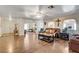 Spacious living room with hardwood floors, comfortable seating, and open floor plan at 3140 Unicorn Ave, Pahrump, NV 89048