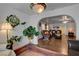 Bright living room featuring hardwood floors, arched doorway, and decorative plants at 3140 Unicorn Ave, Pahrump, NV 89048
