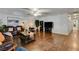 Large living room with hardwood floors, a ceiling fan, and ample space at 3140 Unicorn Ave, Pahrump, NV 89048