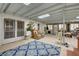Large sun room with skylights, tiled flooring, fireplace and comfortable seating at 3140 Unicorn Ave, Pahrump, NV 89048