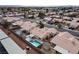 Backyard aerial view featuring a sparkling swimming pool, covered patio, and well-maintained landscaping at 3320 Helmsman Dr, North Las Vegas, NV 89032