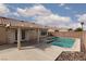 Backyard features refreshing pool and fenced yard at 3320 Helmsman Dr, North Las Vegas, NV 89032