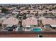 Aerial view of a backyard with a private pool, covered patio, and block wall fencing at 3320 Helmsman Dr, North Las Vegas, NV 89032
