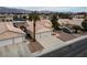 Aerial view of a single-Gathering home with desert landscaping and a two-car garage at 3320 Helmsman Dr, North Las Vegas, NV 89032