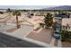 Inviting front exterior showcases a two-car garage and low-maintenance desert landscaping at 3320 Helmsman Dr, North Las Vegas, NV 89032