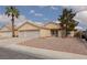 Attractive home with a two-car garage, low-maintenance landscaping, and a traditional design at 3320 Helmsman Dr, North Las Vegas, NV 89032