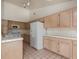 A functional kitchen has a microwave, refrigerator, and ample counter space and cabinets at 3320 Helmsman Dr, North Las Vegas, NV 89032