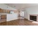 Open kitchen and living room featuring a fireplace and french doors to the yard at 3320 Helmsman Dr, North Las Vegas, NV 89032