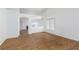 The living room boasts hardwood floors and open archway to kitchen and cozy fireplace at 3320 Helmsman Dr, North Las Vegas, NV 89032