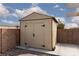 Outdoor shed in a fenced backyard at 3320 Helmsman Dr, North Las Vegas, NV 89032