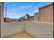 Enclosed patio with white concrete brick wall and view of the community at 3380 Dusa Dr, Las Vegas, NV 89121