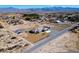 This aerial view showcases the acreage, recreational areas, outbuildings, and the beauty of desert living at 3600 E Bridger St, Pahrump, NV 89061
