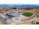 Aerial of newly developed commercial structure including parking, landscaping, and fenced green space at 3600 E Bridger St, Pahrump, NV 89061