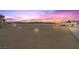 Expansive backyard featuring desert landscaping and an intricate lighting scheme at 3600 E Bridger St, Pahrump, NV 89061