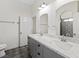 Bathroom featuring dual sinks, marble countertops, and neutral paint colors at 3600 E Bridger St, Pahrump, NV 89061