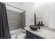 Modern bathroom featuring stylish vanity with bowl sink and tiled shower at 3600 E Bridger St, Pahrump, NV 89061