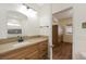 Well-lit bathroom featuring a granite countertop and view into the bedroom at 3600 E Bridger St, Pahrump, NV 89061