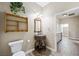 Elegant bathroom featuring a decorative vanity with an ornate mirror, wood accents, and tiled floors at 3600 E Bridger St, Pahrump, NV 89061